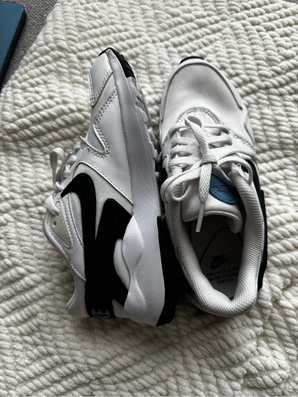 Nike White Sneakers with Black Swoosh and Light Blue Tongue Detail